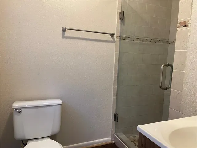 a bathroom with a toilet and a sink