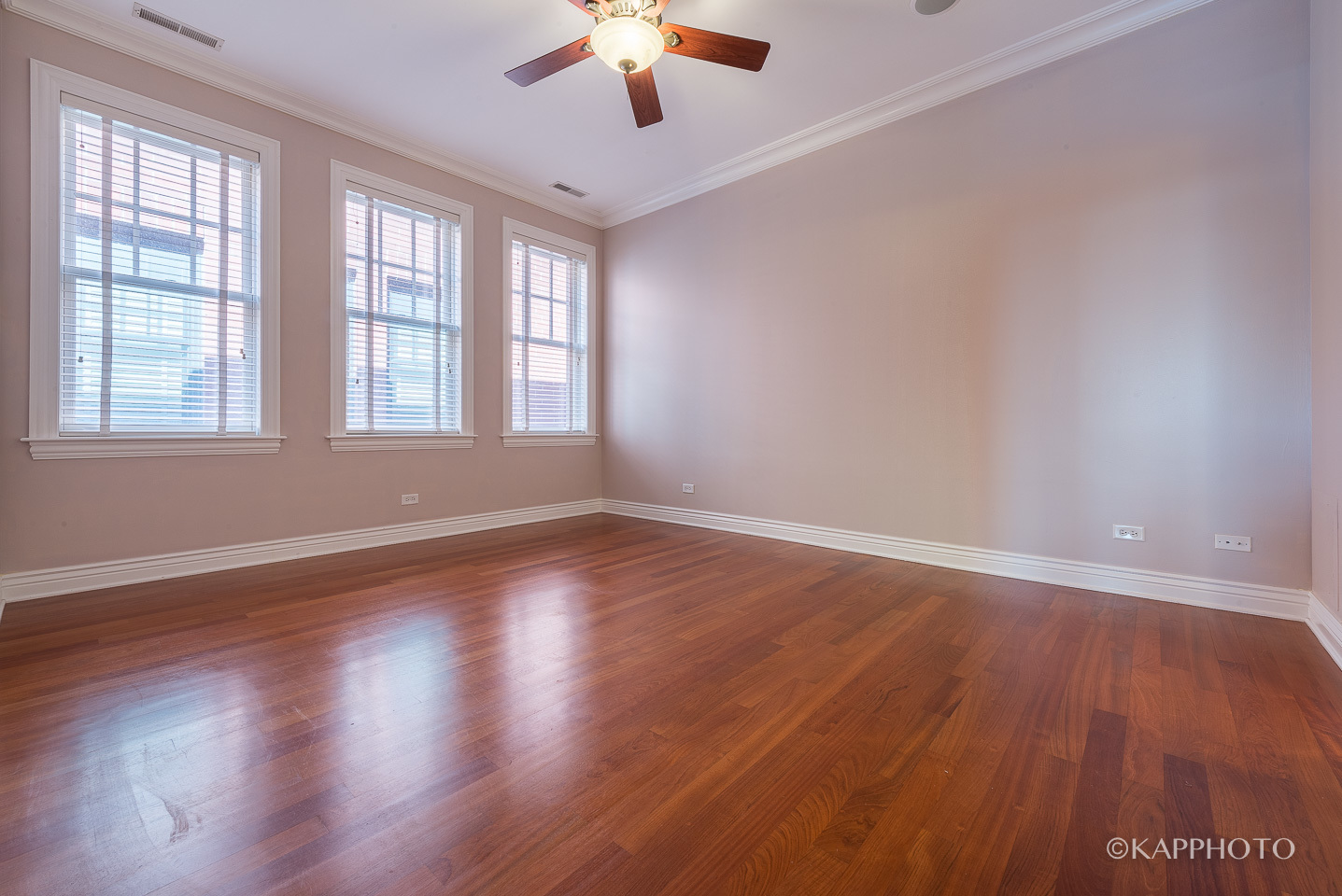 1148 West Monroe Street, Unit 6SW Chicago, IL 60607 - Photo 13 of 15 an empty room with wooden floor and windows