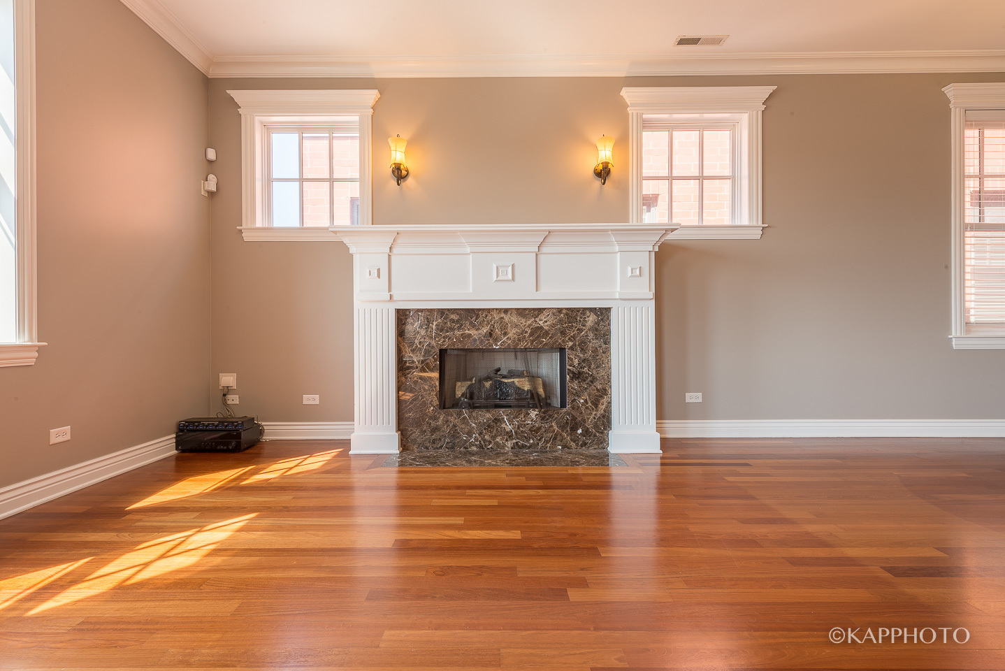1148 West Monroe Street, Unit 6SW Chicago, IL 60607 - Photo 7 of 15 an empty room with windows and a fireplace