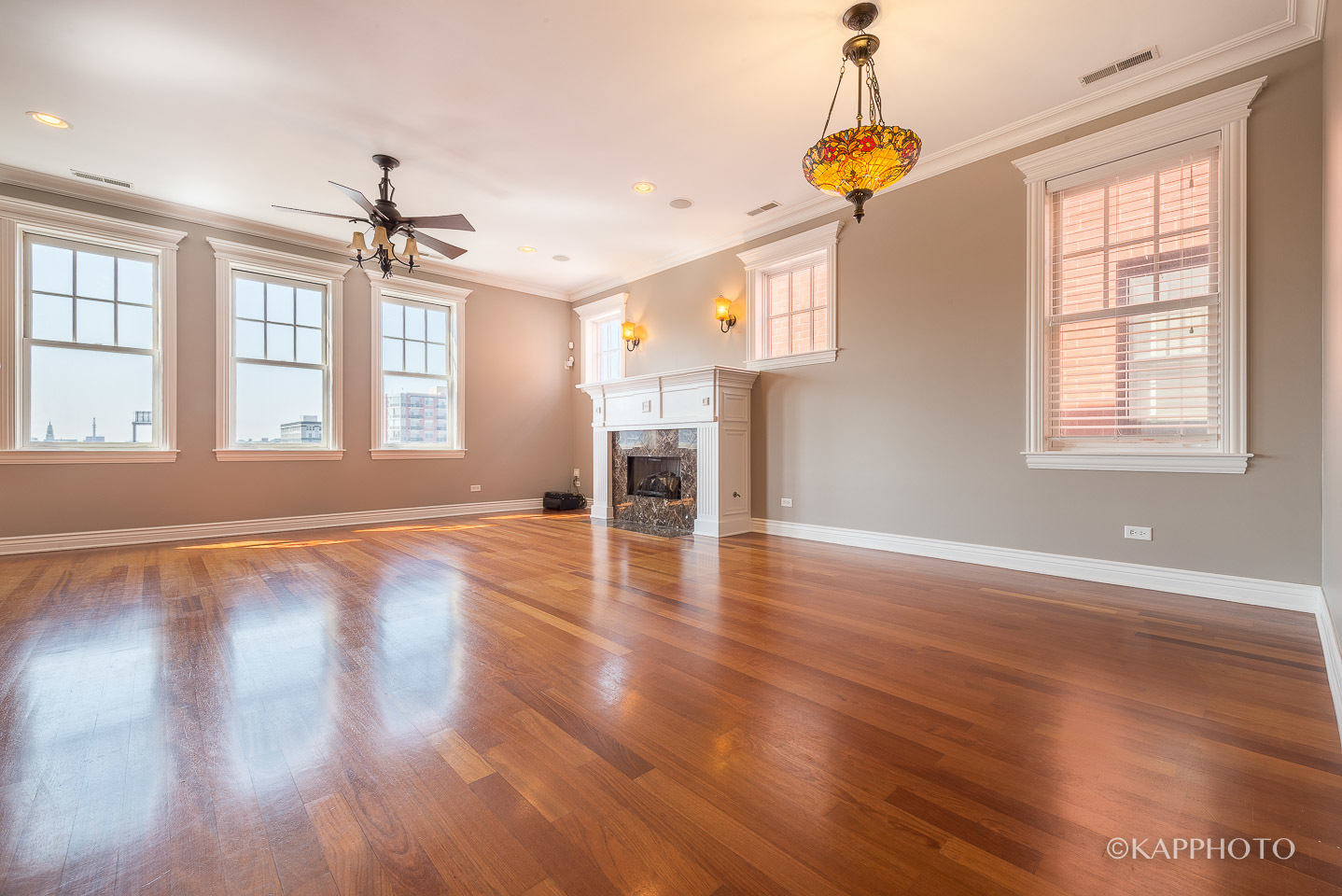1148 West Monroe Street, Unit 6SW Chicago, IL 60607 - Photo 9 of 15 an empty room with wooden floor and windows