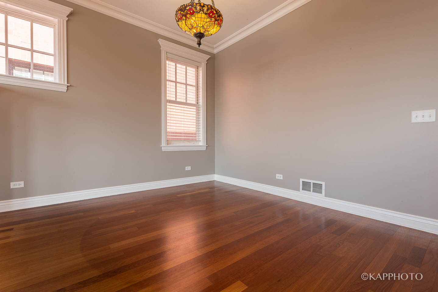 1148 West Monroe Street, Unit 6SW Chicago, IL 60607 - Photo 10 of 15 an empty room with wooden floor and windows