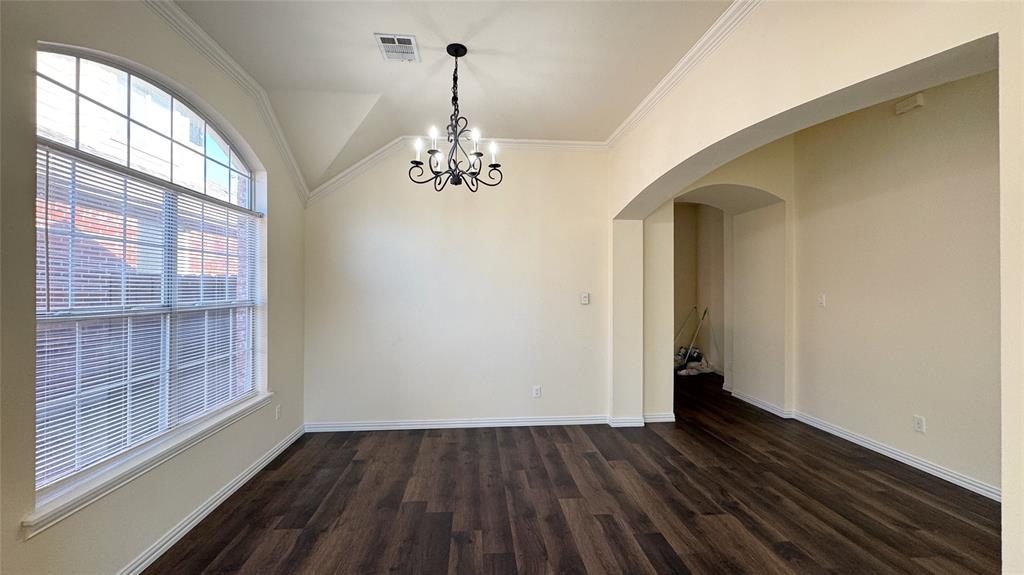 405 Colony Drive Allen, TX 75013 - Photo 5 of 17 a view of empty room with wooden floor and fan