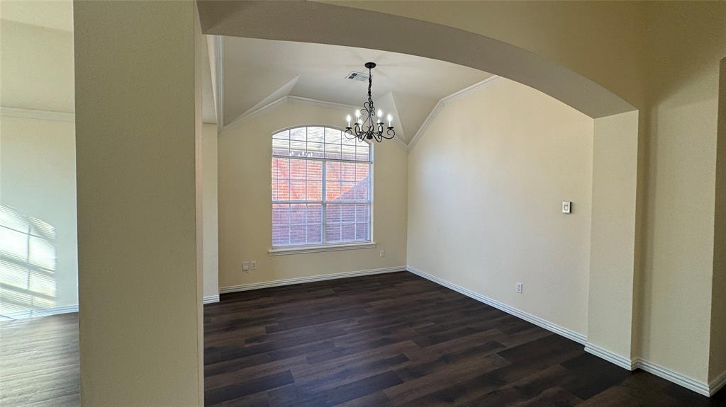 405 Colony Drive Allen, TX 75013 - Photo 9 of 17 a view of an empty room with wooden floor and a window