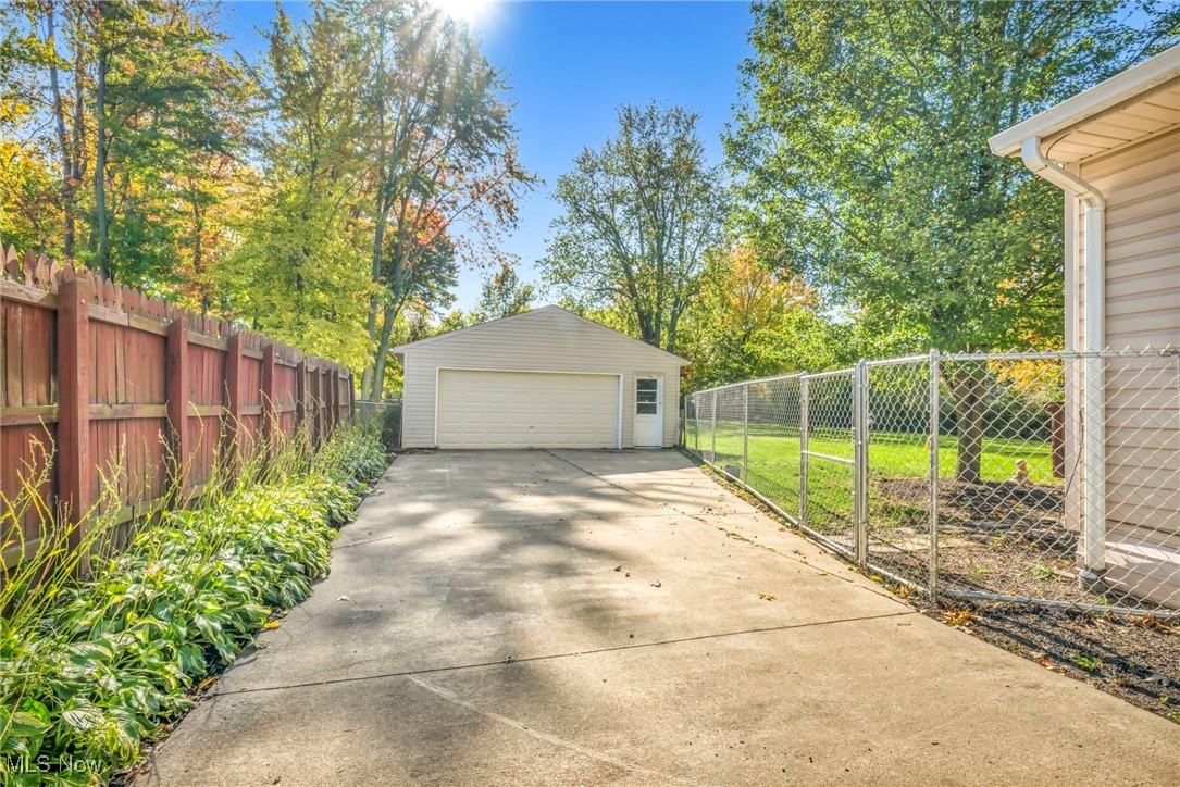 8164 Edgewood Road Mentor, OH 44060 - Photo 40 of 42 Garage featuring a lawn