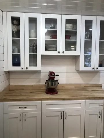 a kitchen with a sink and cabinets