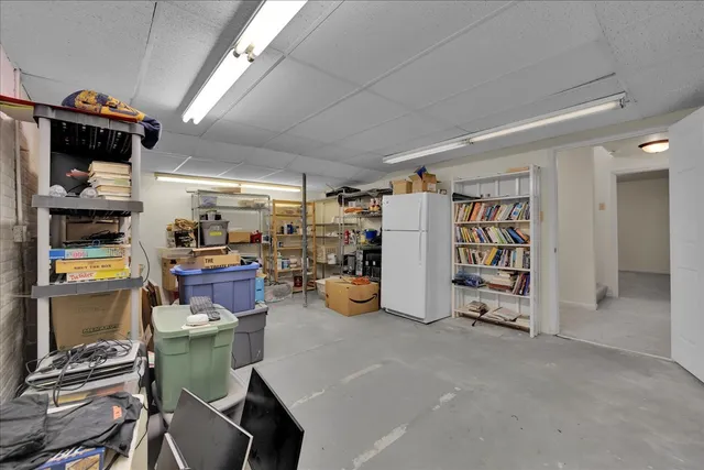 a view of storage and utility room with racks on the wall