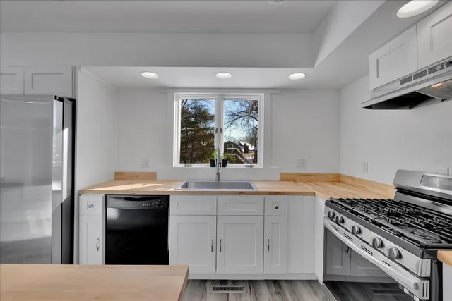 a kitchen with a stove and a refrigerator