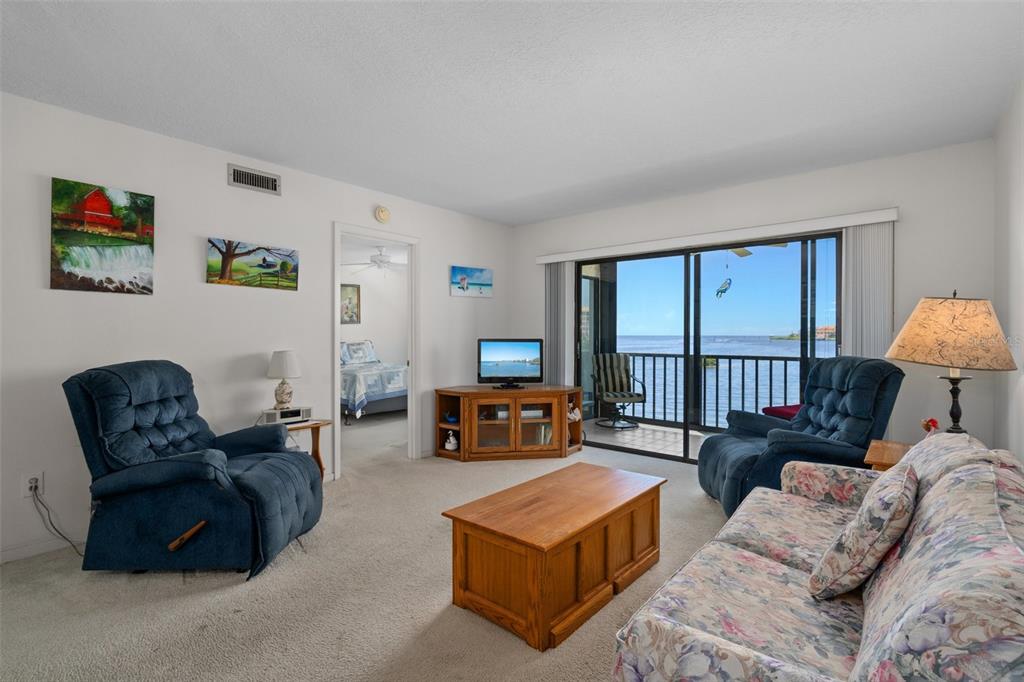 8211 Brent Street, Unit 816 Port Richey, FL 34668 - Photo 12 of 52 a living room with furniture and a window