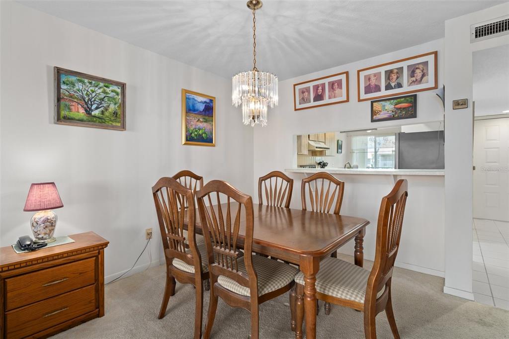 8211 Brent Street, Unit 816 Port Richey, FL 34668 - Photo 14 of 52 a view of a dining room with furniture
