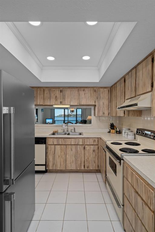 8211 Brent Street, Unit 816 Port Richey, FL 34668 - Photo 20 of 52 a kitchen with stainless steel appliances granite countertop a sink and cabinets