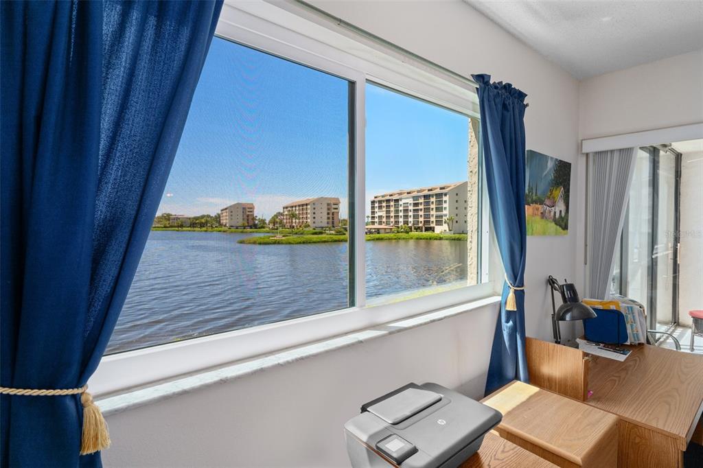 8211 Brent Street, Unit 816 Port Richey, FL 34668 - Photo 25 of 52 a view of a living room and a window with balcony view