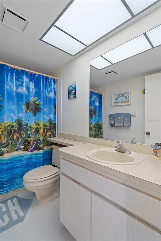 8211 Brent Street, Unit 816 Port Richey, FL 34668 - Photo 32 of 52 a bathroom with a sink a toilet and a mirror