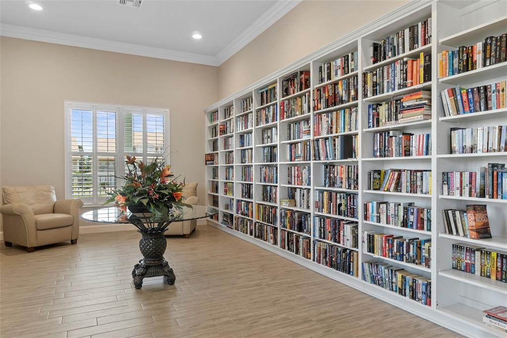 8211 Brent Street, Unit 816 Port Richey, FL 34668 - Photo 41 of 52 a view of living room with furniture book shelf and book shelf