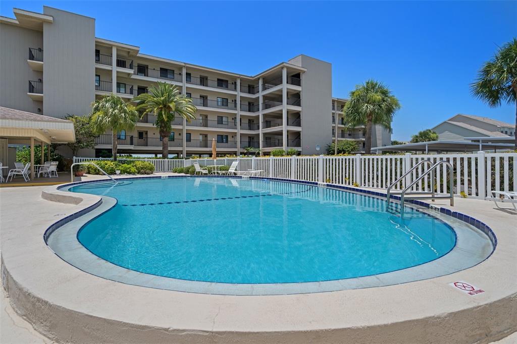 8211 Brent Street, Unit 816 Port Richey, FL 34668 - Photo 48 of 52 a view of outdoor space yard swimming pool and seating