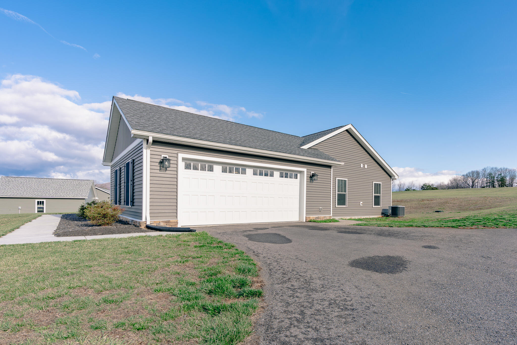 3546 Edwardsville Road Hardy, VA 24101 - Photo 19 of 29 a front view of a house with a yard and garage
