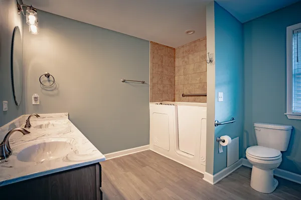 a bathroom with a sink toilet and shower