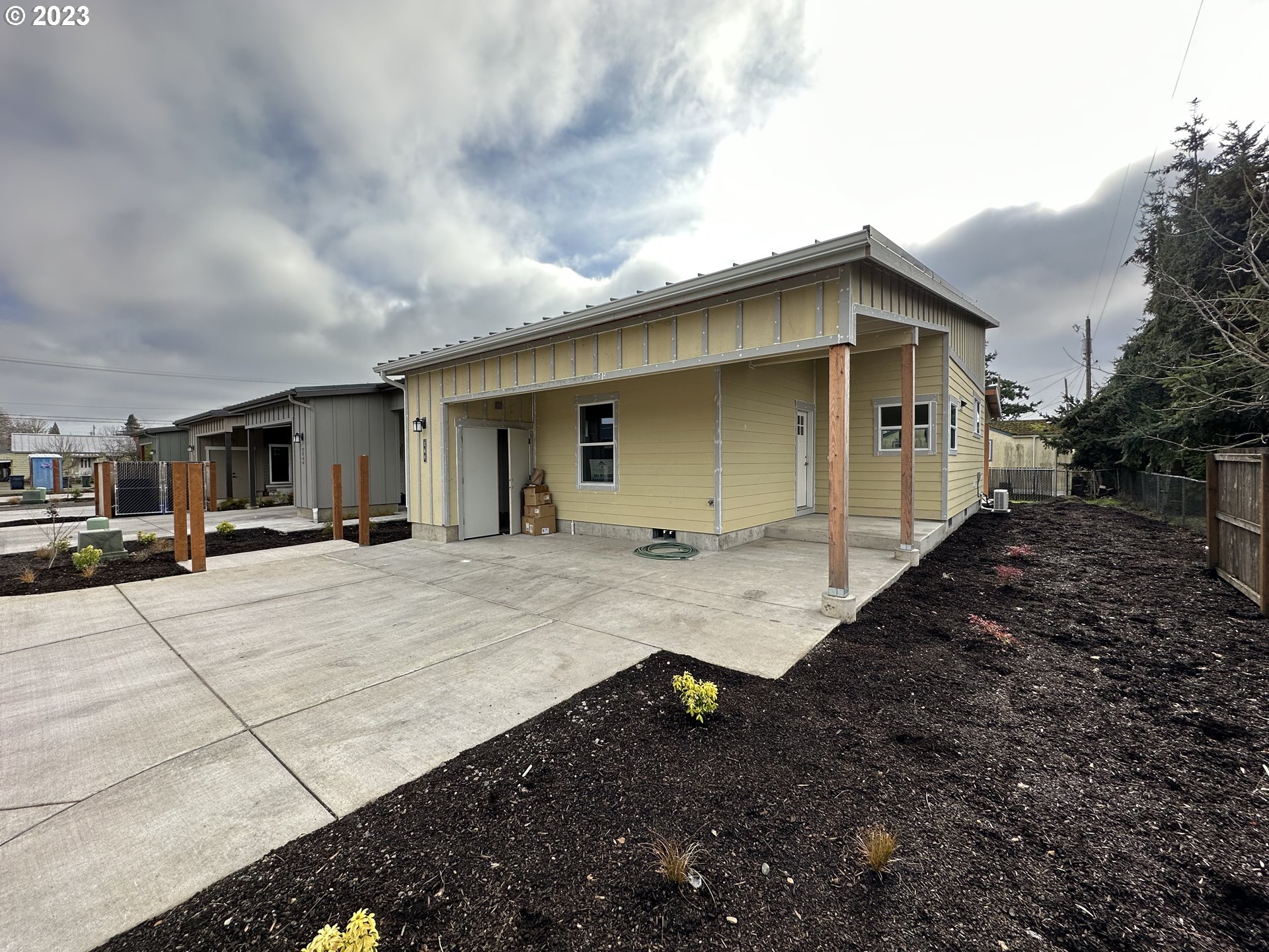 348 19th Springfield, OR 97477 - Photo 1 of 11 a view of a house with backyard and trees