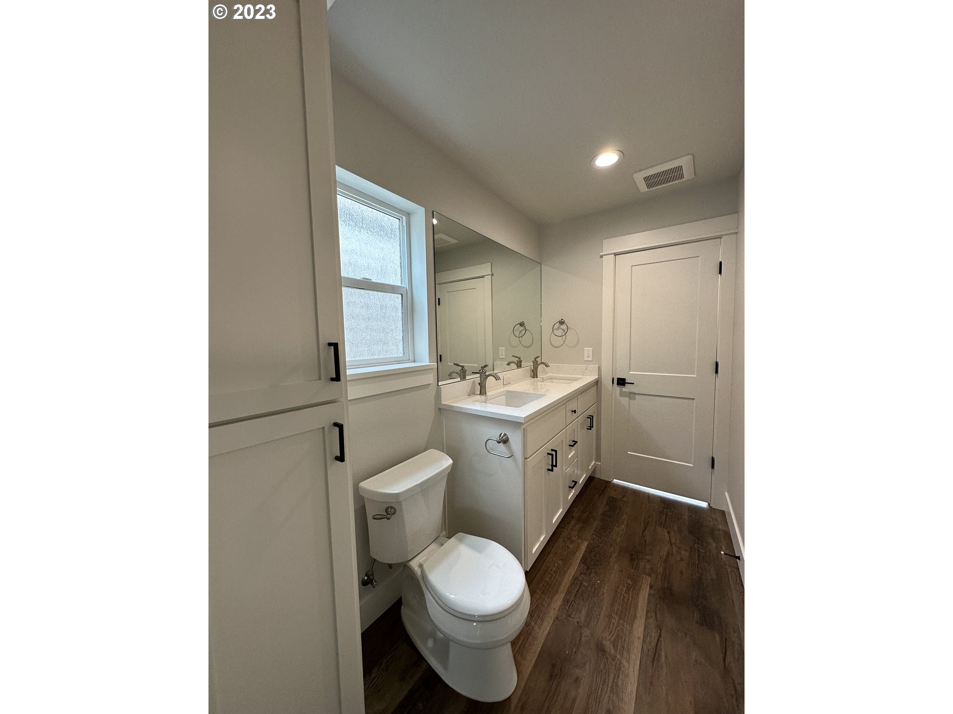 348 19th Springfield, OR 97477 - Photo 6 of 11 a bathroom with a toilet sink and mirror