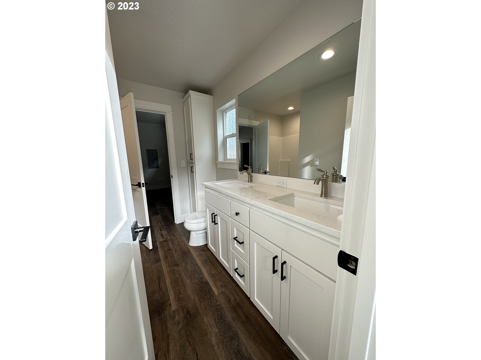 348 19th Springfield, OR 97477 - Photo 8 of 11 a spacious bathroom with a double vanity sink and a mirror