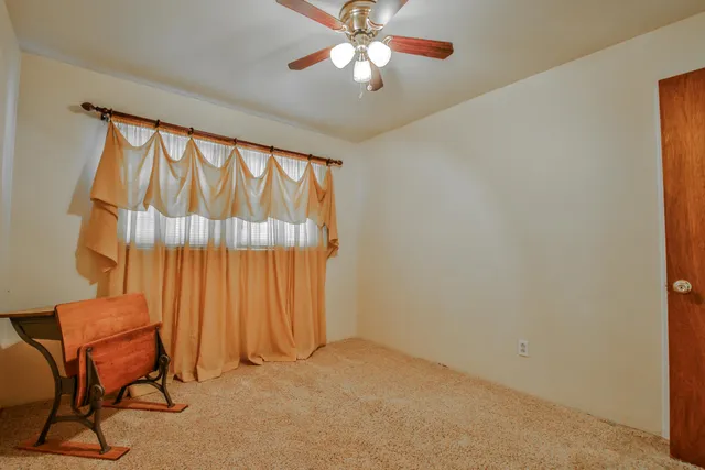 wooden floor in a room next to a window