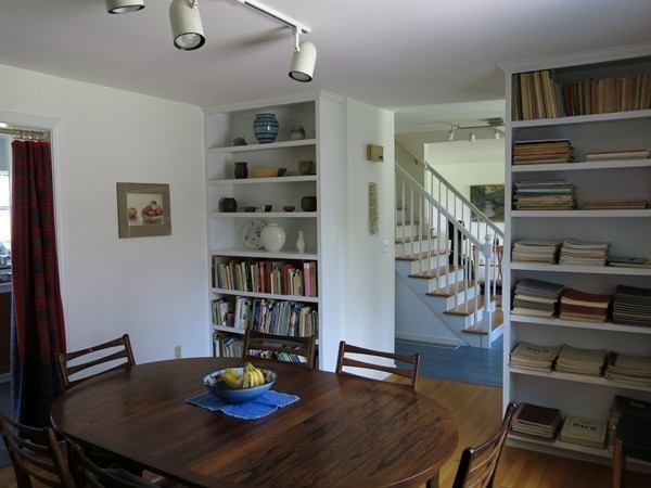 11 Cole Road Williamsburg, MA 01039 - Photo 18 of 30 a living room with lots of furniture and a book shelf