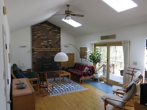 11 Cole Road Williamsburg, MA 01039 - Photo 5 of 30 a living room with furniture a window and a chandelier
