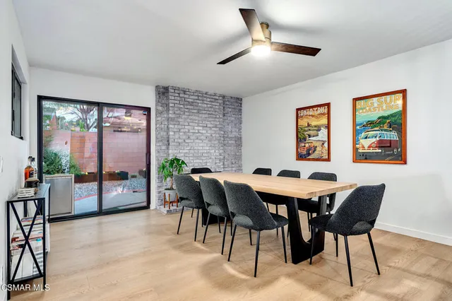 a view of a dining room with furniture window and outside view