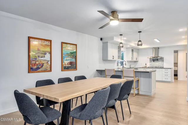 a kitchen with stainless steel appliances a refrigerator sink and cabinets