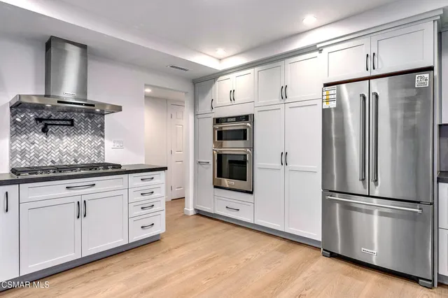 a bed room with a bed and a book shelf