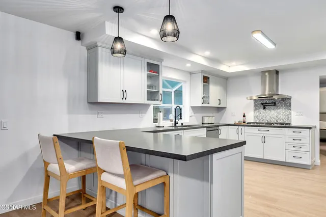 a bath room with a toilet a sink and a bath tub