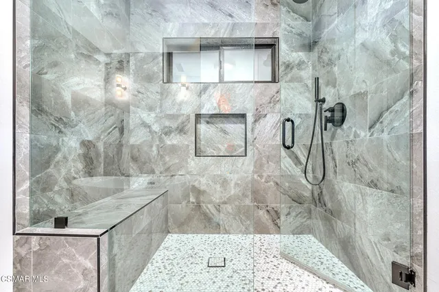 a livingroom with window and furniture