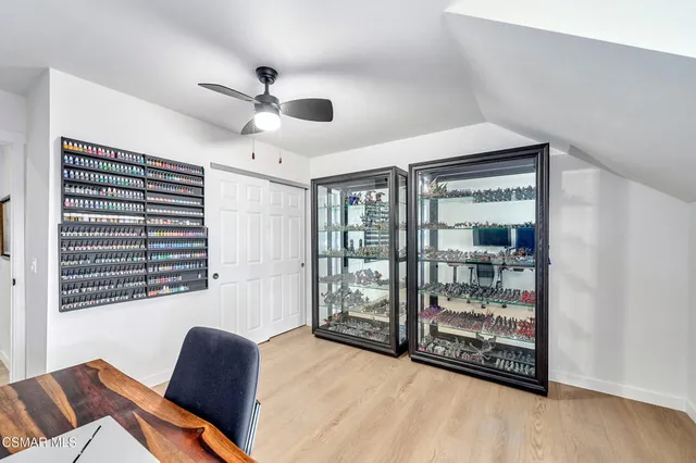 a front view of a house with a yard table and chairs