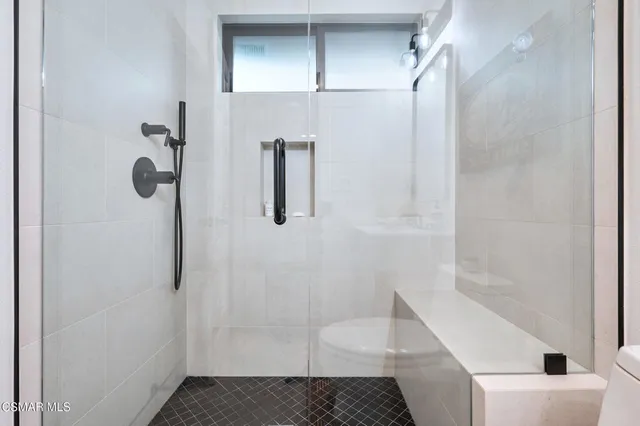 a bunch of flowers in front of a house