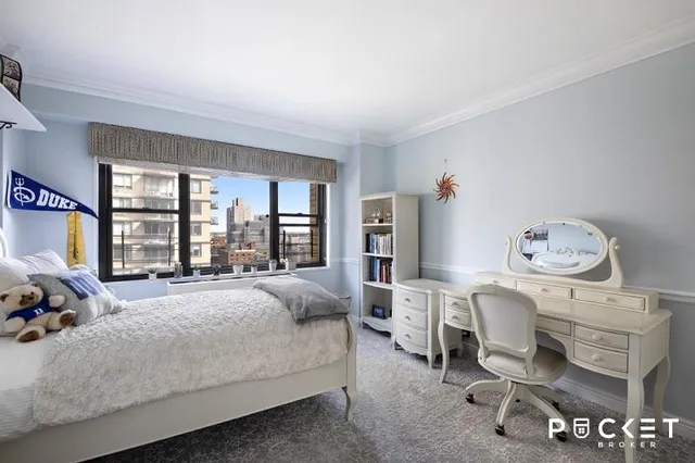 a bed room with a bed and a window