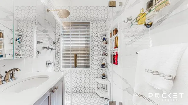 a bathroom with a sink and a shower