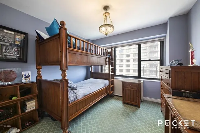 a bedroom with bed and a window