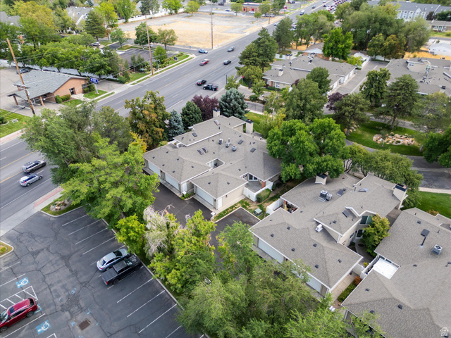 888 East 6895 South Midvale, UT 84047 - Photo 30 of 54 verhead view of the community showcasing mature trees, surrounding streets, and the well-maintained layout of the neighborhood.