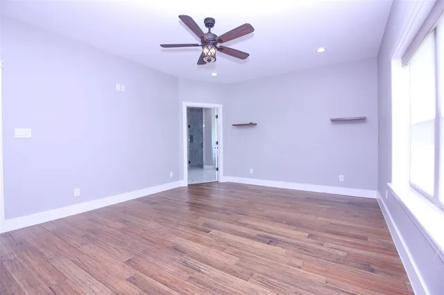 a bathroom with a shower and vanity