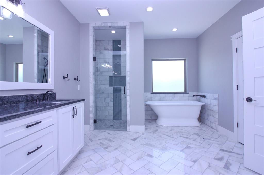 3238 Fm 2048 Boyd, TX 76023 - Photo 20 of 38 a bathroom with a granite countertop sink a toilet and shower