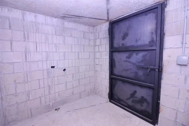 a view of a patio with table and chairs