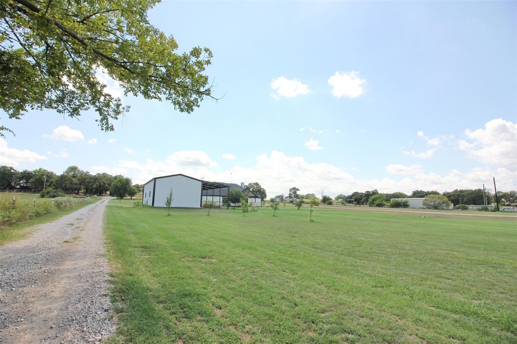 3238 Fm 2048 Boyd, TX 76023 - Photo 35 of 38 a view of a big yard with plants and a large tree