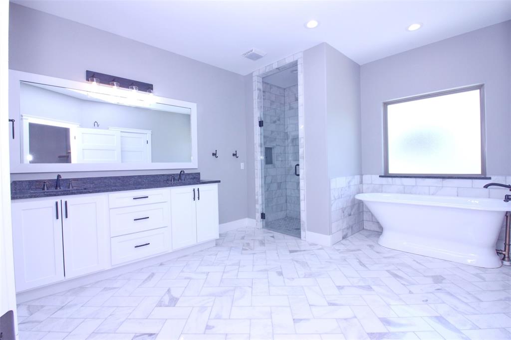 3238 Fm 2048 Boyd, TX 76023 - Photo 5 of 38 a spacious bathroom with a granite countertop sink a toilet and a bathtub