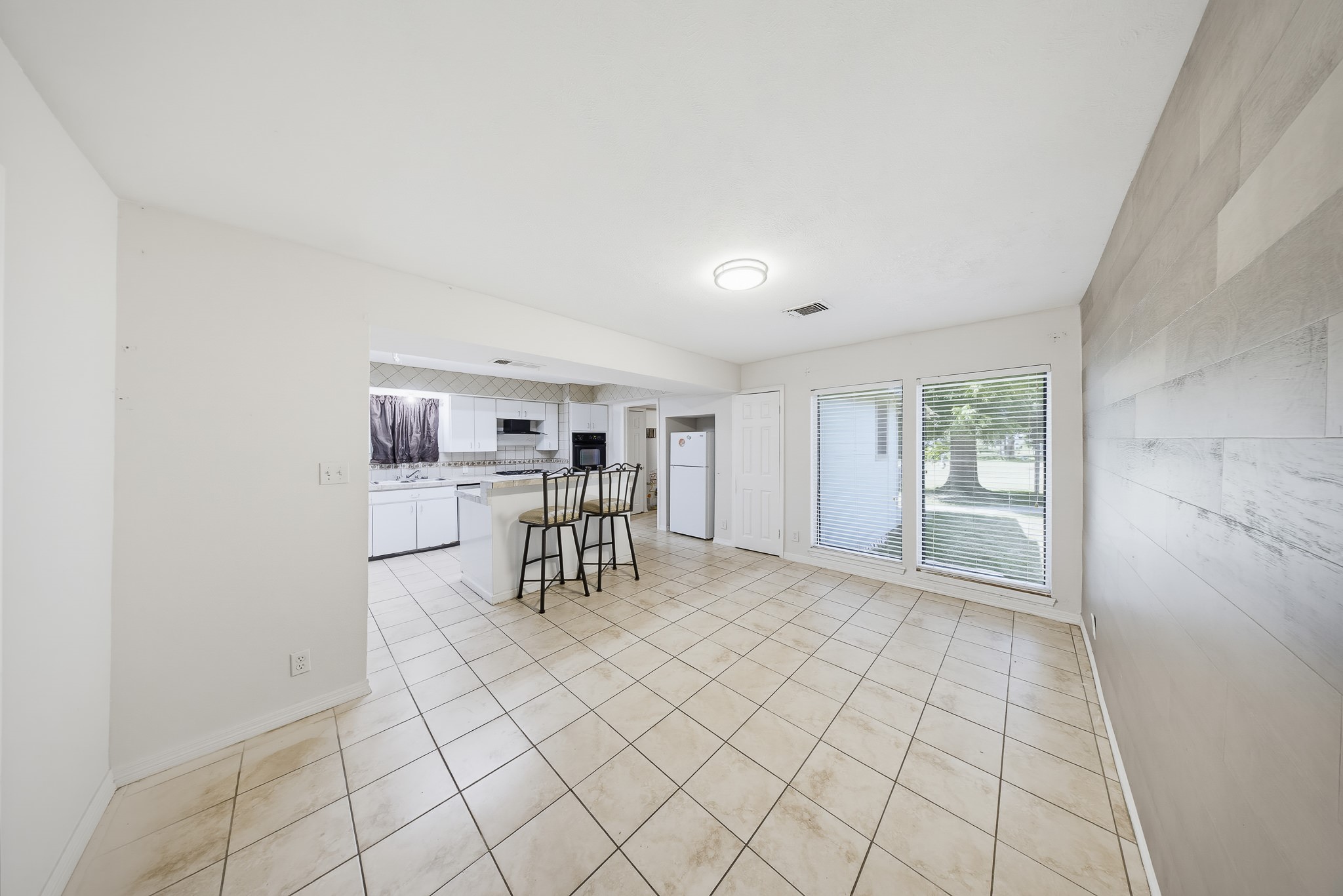 1725 Strawn Road Houston, TX 77039 - Photo 19 of 44 The kitchen and dining areas connect naturally, creating an easy central gathering space.