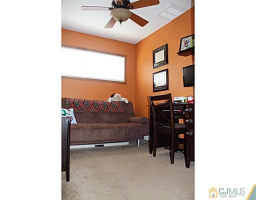 8 Colton Road Edison, NJ 08817 - Photo 13 of 19 a bedroom with a bed and a ceiling fan