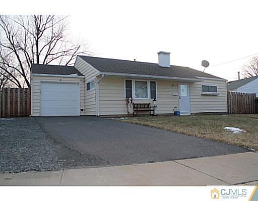 8 Colton Road Edison, NJ 08817 - Photo 18 of 19 a front view of a house with a yard