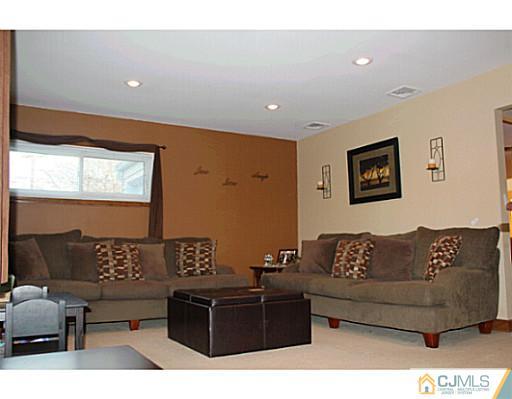 8 Colton Road Edison, NJ 08817 - Photo 3 of 19 a living room with furniture and a large window