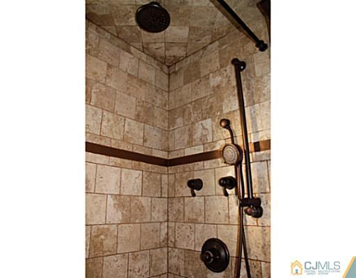 8 Colton Road Edison, NJ 08817 - Photo 9 of 19 a bathroom with a shower