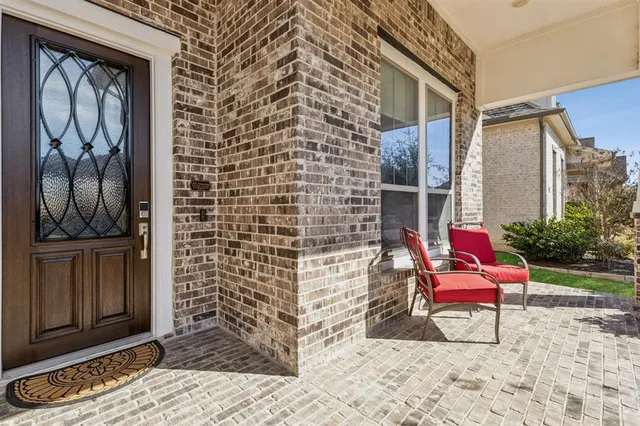a bench sitting in front of a door