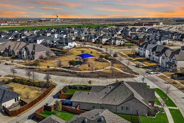 an aerial view of a patio and swimming pool