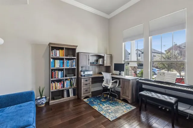 a work room with furniture and a book shelf